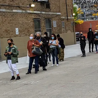 Voters waiting in an early-voting line outside a polling site