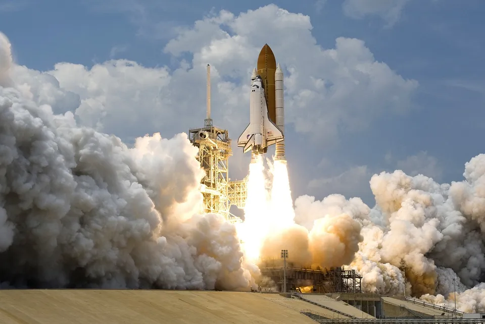 A rocket lifts off from a launch pad