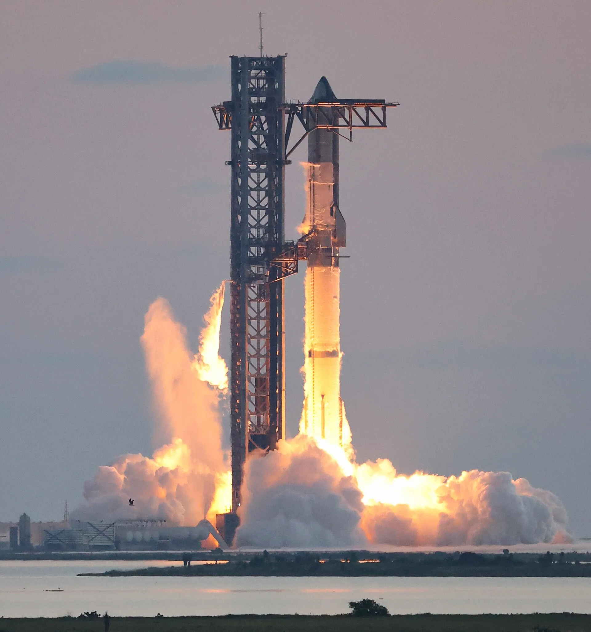 A SpaceX Starship rocket lifting off from Starbase, Texas