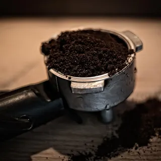 Ground coffee in an espresso basket